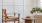 chair neat a white wall and plant