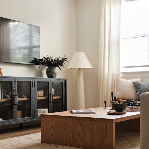 Beautiful living spaces with natural lighting living room with a couch coffee table and tv
