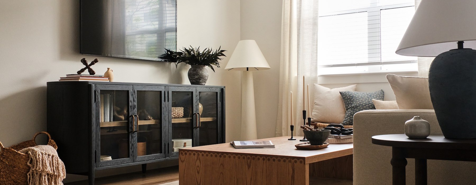 living room with a couch coffee table and tv