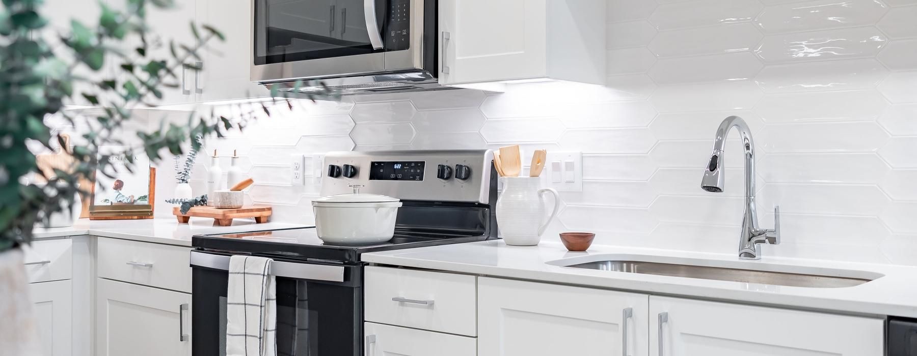 a kitchen with white cabinets